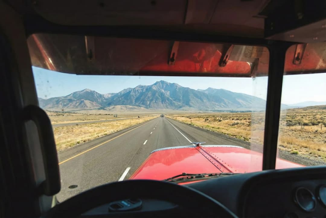 Trucker's hands on steering wheel